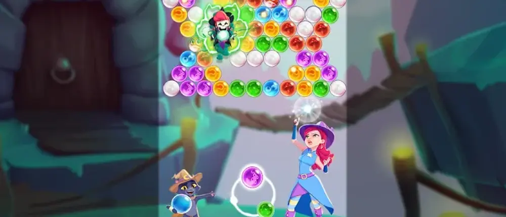 Bubble Witch 3 Saga gameplay: aiming a bubble at a coloured cluster on the board