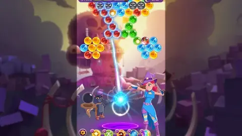 Bubble Witch 3 Saga level with a bubble bouncing toward a coloured cluster