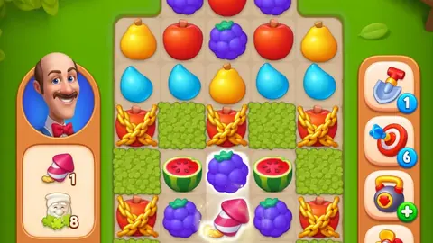 Gardenscapes match-3 board with fruit tiles and boosters